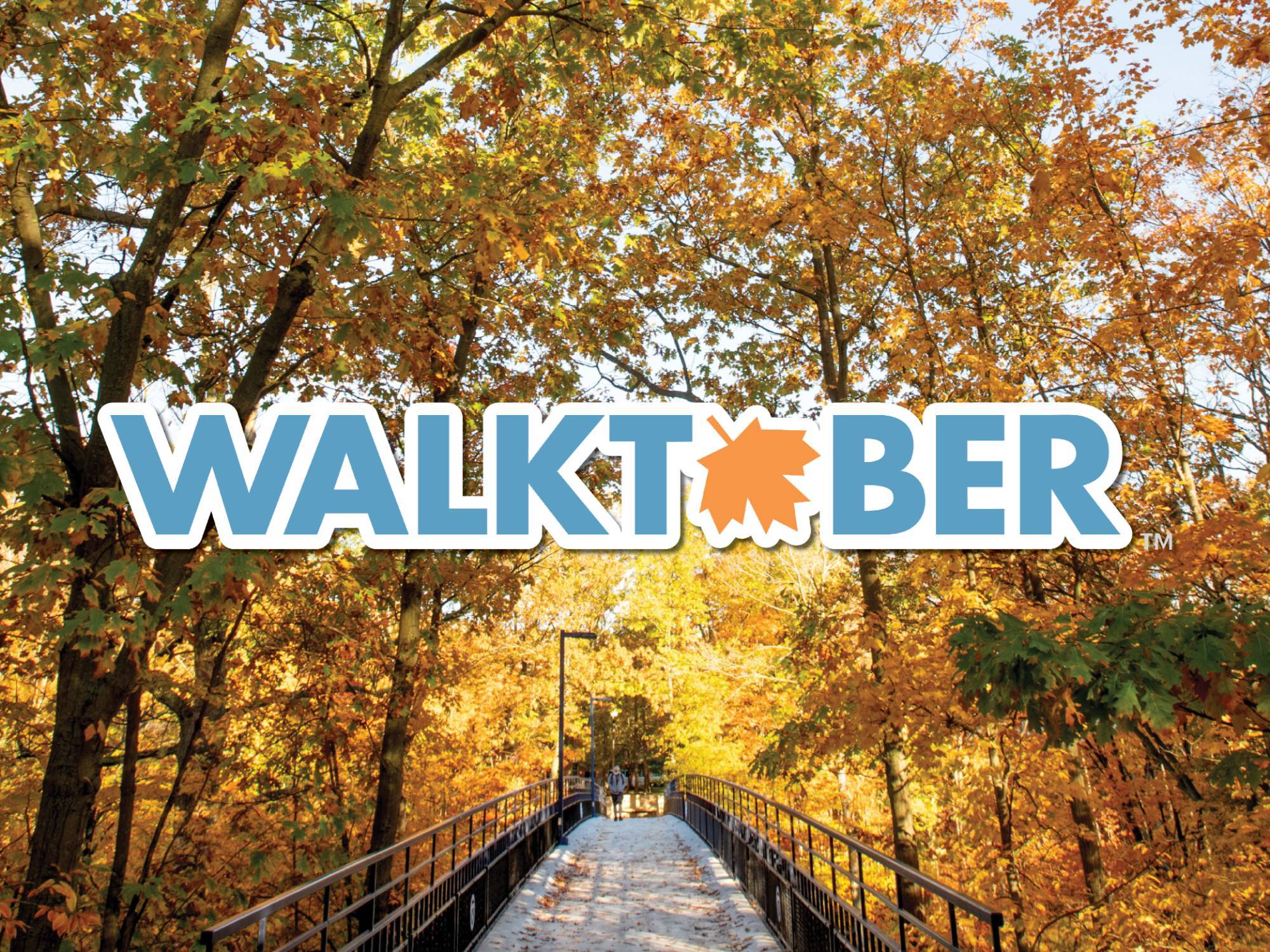 Walktober logo with a photo of fall leaves in the background